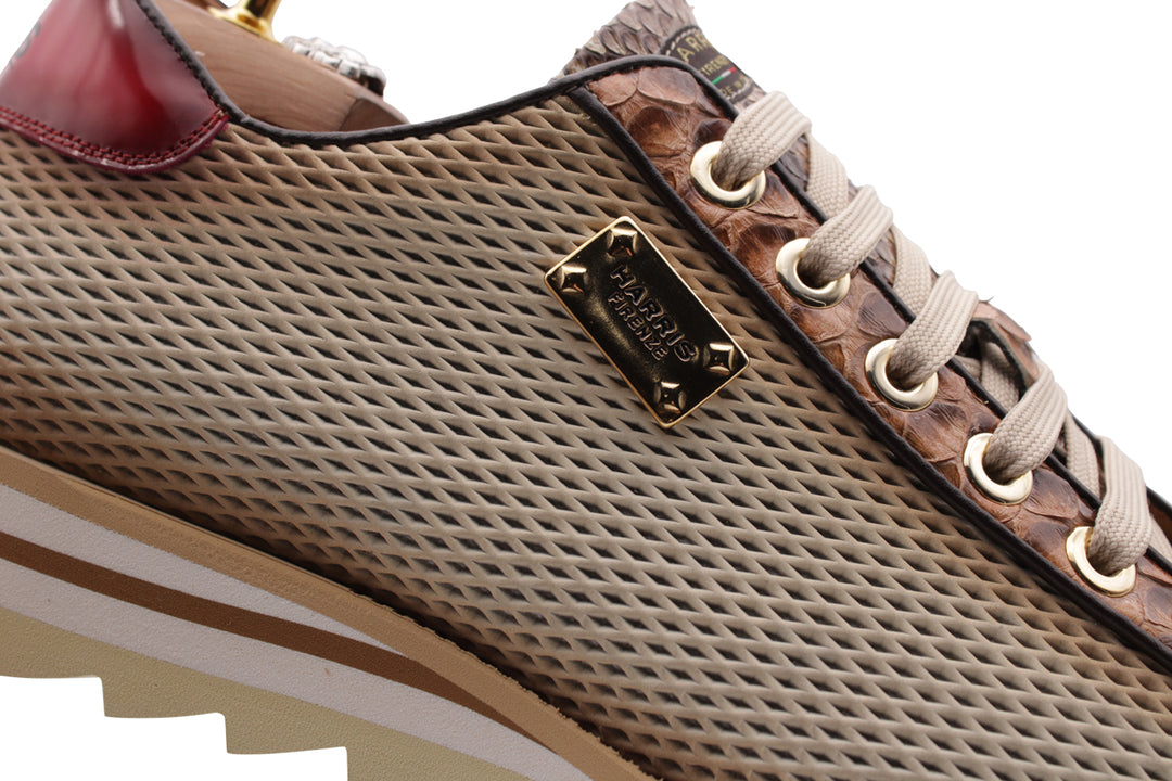 Sneakers in pitone ed effetto traforato