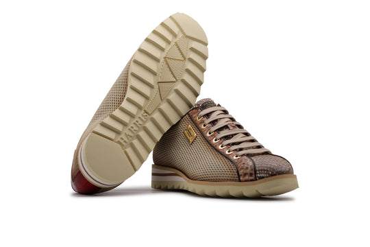 Sneakers in pitone ed effetto traforato